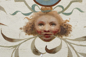 Plafond de la 4e volée : détail d'une tête. © Région Bourgogne-Franche-Comté, Inventaire du patrimoine