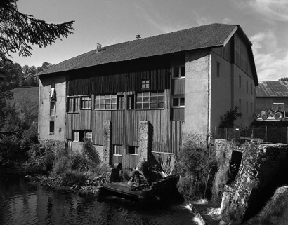 Façade postérieure du moulin Choudet. © Région Bourgogne-Franche-Comté, Inventaire du patrimoine Façade postérieure du moulin Choudet. © Région Bourgogne-Franche-Comté, Inventaire du patrimoine