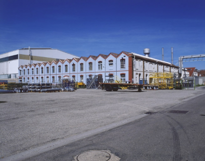Vue de trois quarts de l'atelier de grosse construction. © Région Bourgogne-Franche-Comté, Inventaire du patrimoine Vue de trois quarts de l'atelier de grosse construction. © Région Bourgogne-Franche-Comté, Inventaire du patrimoine