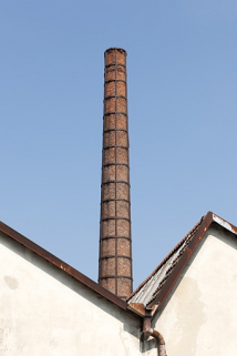 Sheds et cheminée de l'atelier de laitonnerie. © Région Bourgogne-Franche-Comté, Inventaire du patrimoine Sheds et cheminée de l'atelier de laitonnerie. © Région Bourgogne-Franche-Comté, Inventaire du patrimoine