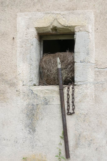 Façade postérieure des parties agricoles, détail d'une baie en accolade. © Région Bourgogne-Franche-Comté, Inventaire du patrimoine Façade postérieure des parties agricoles, détail d'une baie en accolade. © Région Bourgogne-Franche-Comté, Inventaire du patrimoine