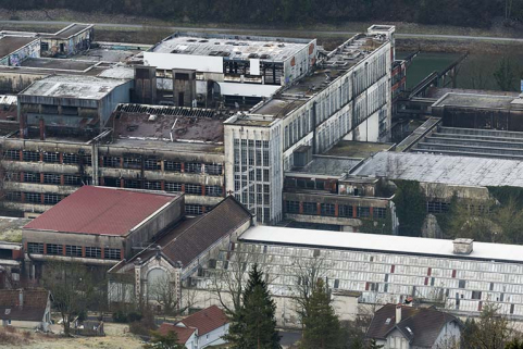 Etat en 2016. Usine A : vue plongeante depuis le nord sur la partie centrale. Chaufferie et atelier de réparation (sheds) au premier plan, étirage et filature tergal au second plan. © Région Bourgogne-Franche-Comté, Inventaire du patrimoine
