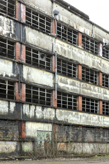Etat en 2016. Usine A : travées de la façade nord du bâtiment de filature et tissage. © Région Bourgogne-Franche-Comté, Inventaire du patrimoine