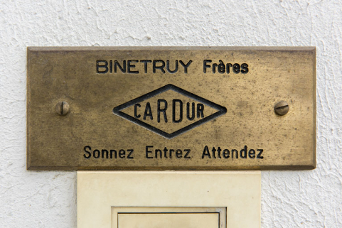 Plaque professionnelle de la société Binétruy Frères. © Région Bourgogne-Franche-Comté, Inventaire du patrimoine Plaque professionnelle de la société Binétruy Frères. © Région Bourgogne-Franche-Comté, Inventaire du patrimoine