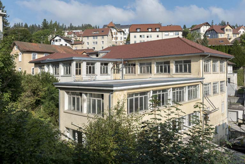 Usine : façade latérale gauche et corps bâti entre 1939 et 1951 en retour contre la façade postérieure. © Région Bourgogne-Franche-Comté, Inventaire du patrimoine