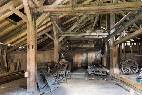 Intérieur de la grange, depuis l'entrée à l'ouest. © Région Bourgogne-Franche-Comté, Inventaire du patrimoine Intérieur de la grange, depuis l'entrée à l'ouest. © Région Bourgogne-Franche-Comté, Inventaire du patrimoine