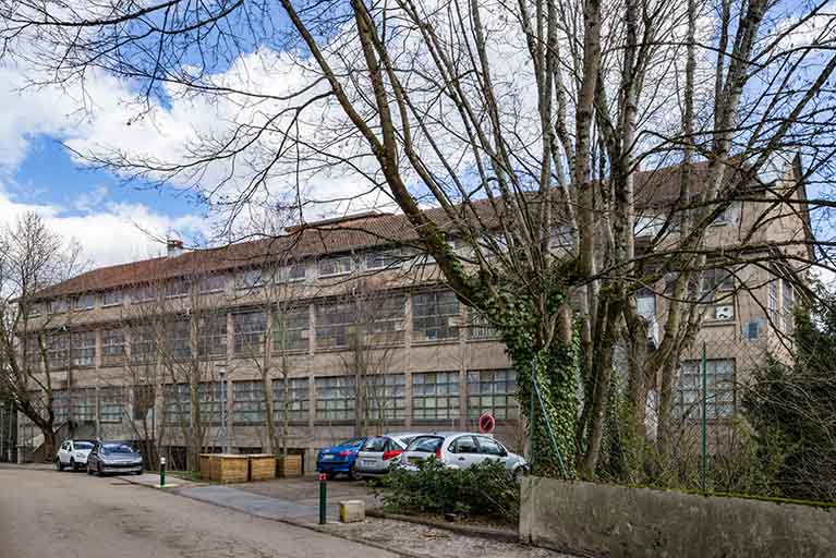 Façade ouest de l'entrepôt industriel. © Jérôme Mongreville / Région Bourgogne-Franche-Comté, Inventaire du patrimoine - 2019 Façade ouest de l'entrepôt industriel. © Jérôme Mongreville / Région Bourgogne-Franche-Comté, Inventaire du patrimoine - 2019