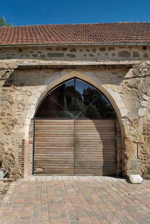 Chapelle : arcade transformée en porte du mur de long-pan sur cour. © Pierre-Marie Barbe-Richaud / Région Bourgogne-Franche-Comté, Inventaire du patrimoine - 2008